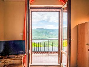 a room with a large window with a view at Apartment Bomba vista lago 7 by Interhome in Villa Santa Maria