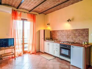 a kitchen with a sink and a stove at Apartment Bomba vista lago 7 by Interhome in Villa Santa Maria +23 photos