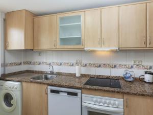 a kitchen with a sink and a dishwasher at Apartment Ronda Creixell by Interhome in Creixell