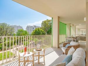 a living room with a couch and a table on a balcony at Holiday Home Nerva by Interhome in Denia