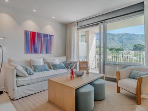 a living room with a couch and a table at Holiday Home Nerva by Interhome in Denia