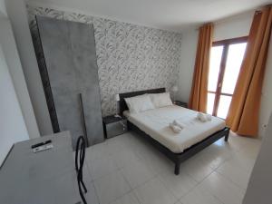 Postel nebo postele na pokoji v ubytování Guest house Sinisi
