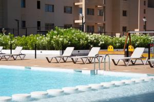 Bazén v ubytovaní Apartamento de 3 dormitorios, piscina y parking alebo v jeho blízkosti