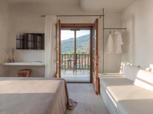 Postel nebo postele na pokoji v ubytování Om Living Pelion