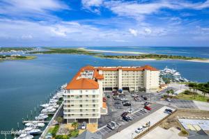 an aerial view of a hotel and a marina with boats at Waterfront Resort , World Class Marina & Slip in Beaufort
