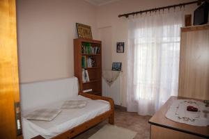 Postel nebo postele na pokoji v ubytování Lixouri Central Residence