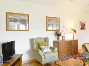 TV a/nebo společenská místnost v ubytování Paterson Cottage