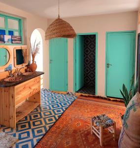 a bathroom with turquoise doors and a sink at Moroccan Boho Surf House in Agadir +162 photos