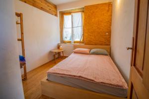 a bedroom with a bed in a small room at ELIAS Residency in Rob