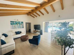 a living room with a white couch and a table at Villa V in Svetvinčenat