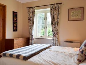 En eller flere senge i et værelse på Y Bwthyn