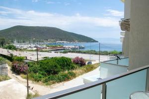a balcony with a view of a beach at Villa Afrodite in Néa Péramos