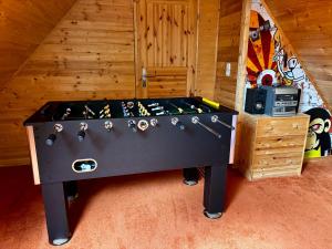 a ping pong table in the middle of a room at Ferienwohnung Micaela in Haselünne