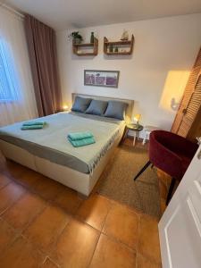 Postel nebo postele na pokoji v ubytování Apartmán Pipi Holiday Village 8A