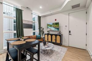 a living room with a table and a couch at Sleep 3- Beautiful Unit- Walk Around in Old City in Philadelphia