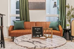 a living room with a couch and a coffee table at Sleep 3- Beautiful Unit- Walk Around in Old City in Philadelphia +14 photos