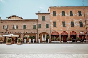 an empty street in front of a building at Casa Gotica in Castelfranco Emilia