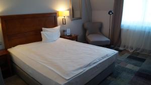 Voodi või voodid majutusasutuse Hotel Rejs toas