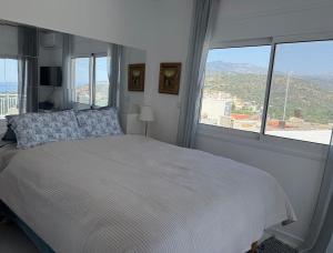 Postel nebo postele na pokoji v ubytování Leemore's Kalo Chorio