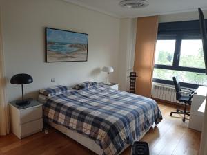 A bed or beds in a room at Bonita vivienda en San Sebastian de los Reyes