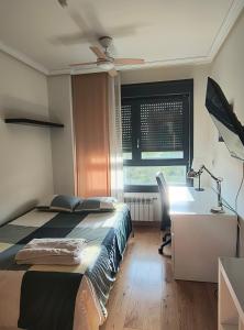 A bed or beds in a room at Bonita vivienda en San Sebastian de los Reyes