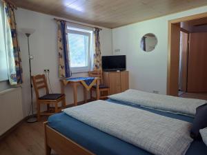 TV a/nebo společenská místnost v ubytování Appartement Etschbacher
