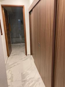 a hallway with a door and a tile floor at Suite Privada frente a Vidanta Queen in Nuevo Vallarta +9 photos