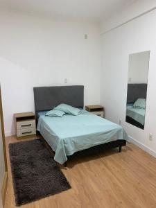 Ένα ή περισσότερα κρεβάτια σε δωμάτιο στο Casa confortável em Penha