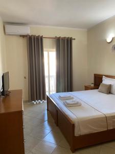 Postel nebo postele na pokoji v ubytování Relax Apartment & Hotel
