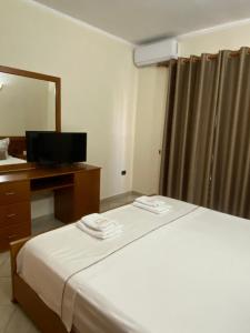 Postel nebo postele na pokoji v ubytování Relax Apartment & Hotel
