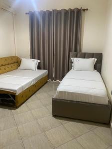 Postel nebo postele na pokoji v ubytování Relax Apartment & Hotel