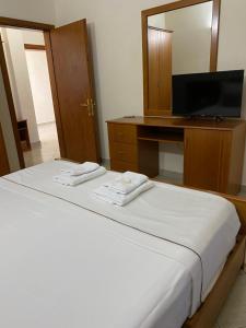 Postel nebo postele na pokoji v ubytování Relax Apartment & Hotel