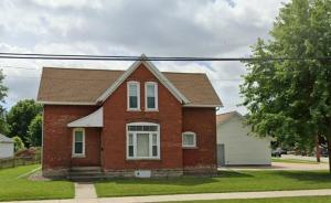 a red brick house on a street at Charming Brick House in Little Chute