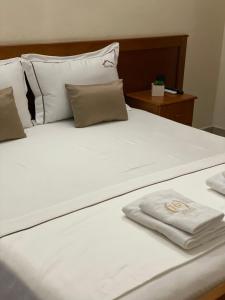 Postel nebo postele na pokoji v ubytování Relax Apartment & Hotel