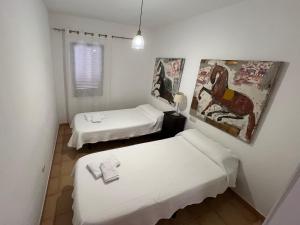 Ein Bett oder Betten in einem Zimmer der Unterkunft Anahi Homes Corralejo - Villa Dracaena 2