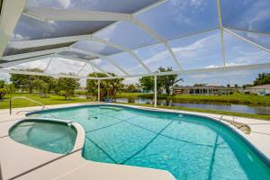 a large swimming pool with a white cover over it at Casa Mar Van Beautiful Property with Heated Pool and Spa minutes to beaches and golf in Rotonda West