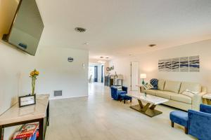 a living room with a couch and a table at Casa Mar Van Beautiful Property with Heated Pool and Spa minutes to beaches and golf in Rotonda West