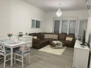 a living room with a couch and a table at LoKA apartman in Paraćin