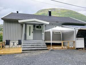 a house with a porch with a table and chairs at Stryn Norway in Stryn