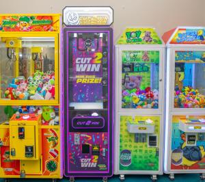 a group of four arcade games in a room at Chincoteague Bay RV Resort & Cottages in Chincoteague