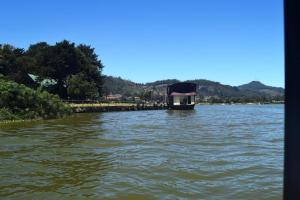 a boat in the water on a river at Daffodil's Hotel in Nuwara Eliya