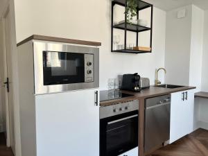 Dapur atau dapur kecil di La suite - King bed - Spacieux - Calme