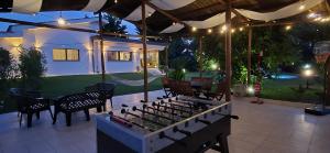 an outdoor patio with a stove and a table at ALFA COUNTRY HOUSE Villa Salento in Lequile