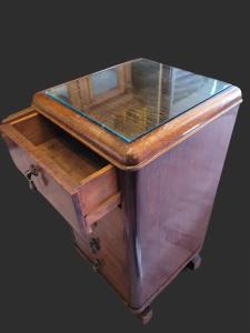 a wooden cabinet with a glass top on a table at Hotel Boutique Premium Exclusivo in Paine