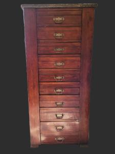 a wooden dresser with five drawers on it at Hotel Boutique Premium Exclusivo in Paine