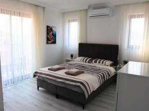 Ένα ή περισσότερα κρεβάτια σε δωμάτιο στο Villa Angora Sarigerme