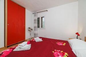 Postel nebo postele na pokoji v ubytování Apartments Tasa