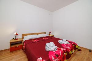 Postel nebo postele na pokoji v ubytování Apartments Tasa
