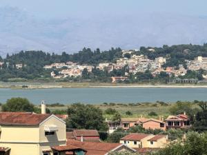 a city with houses and a body of water at VITHΟS SUITE Luxury Living in Virós