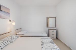Postel nebo postele na pokoji v ubytování Apartment UGA
